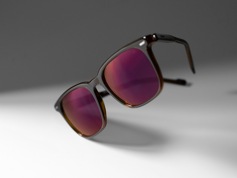 ZEISS DuraVision Gold UV lens coating on tinted sunglass lenses in Burgundy colour.