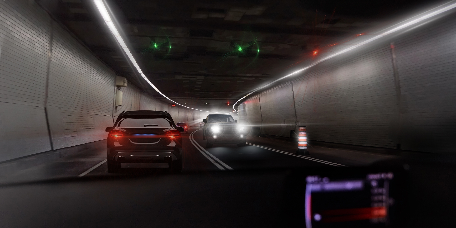 Two images of the point of view of a driver in a tunnel with incoming traffic, showing on one image glare from the car and tunnel lights and one the other image clearly reduced glare.