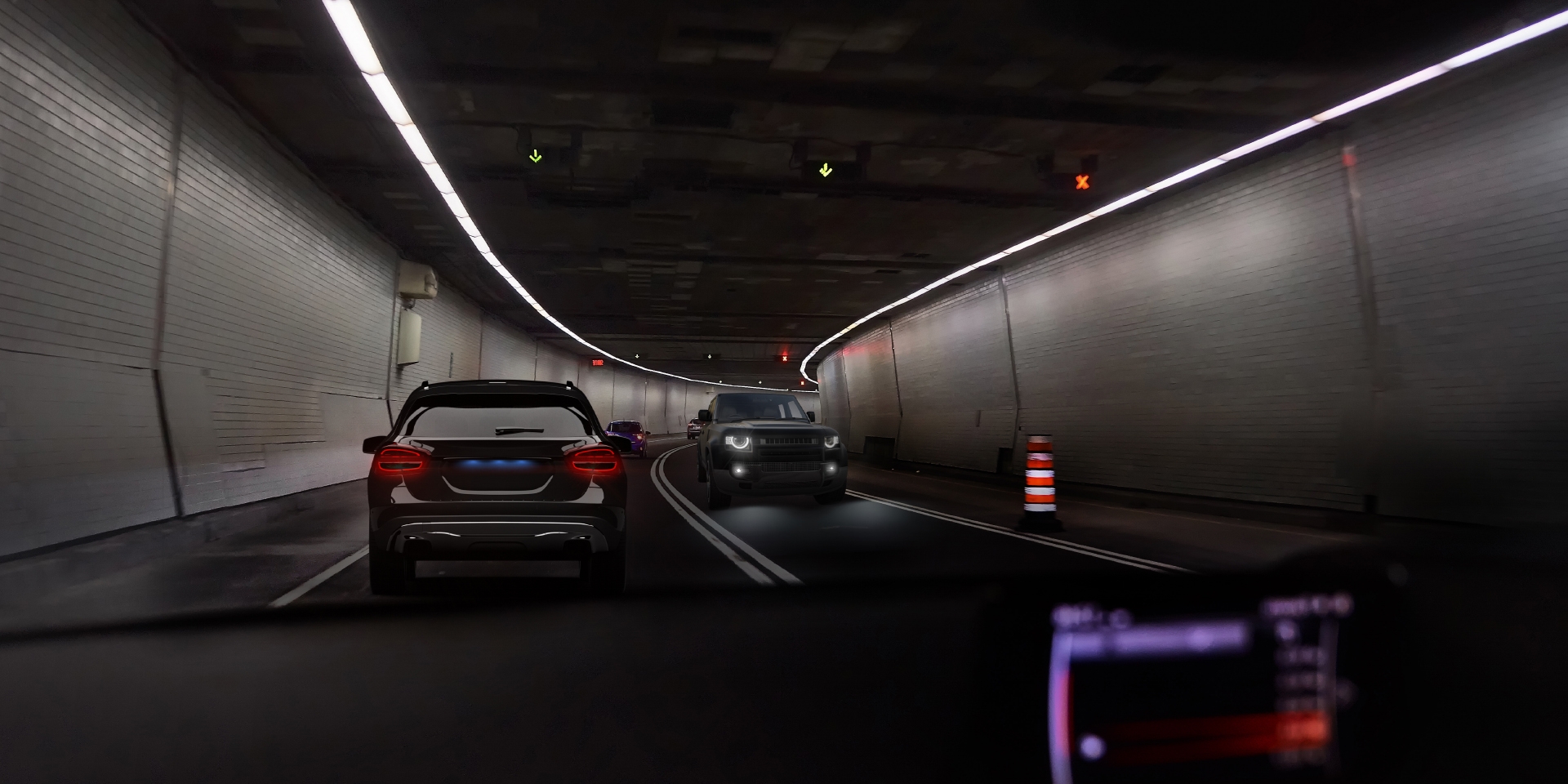 Two images of the point of view of a driver in a tunnel with incoming traffic, showing on one image glare from the car and tunnel lights and one the other image clearly reduced glare.