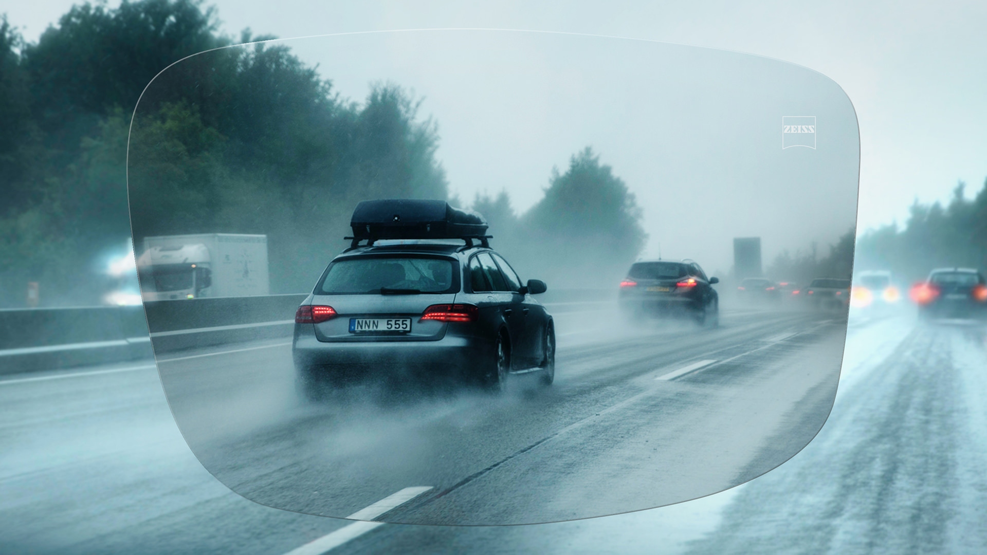 View through ZEISS DriveSafe Single Vision lens of a motorway on a rainy day 